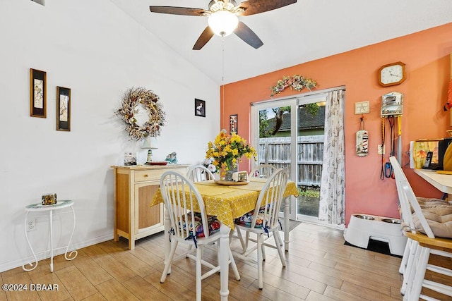 dining room with ceiling fan and lofted ceiling