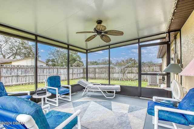 sunroom featuring ceiling fan