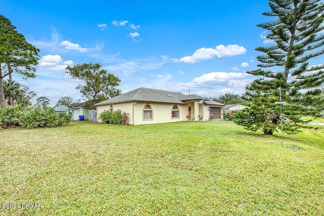 view of yard with a garage