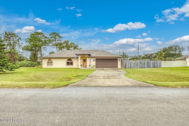 view of front facade featuring a front yard and a garage