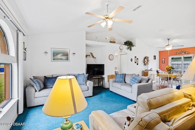 living room featuring vaulted ceiling, ceiling fan, and plenty of natural light