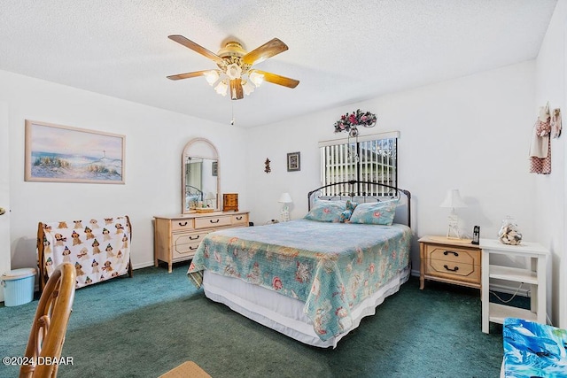 carpeted bedroom with a textured ceiling and ceiling fan