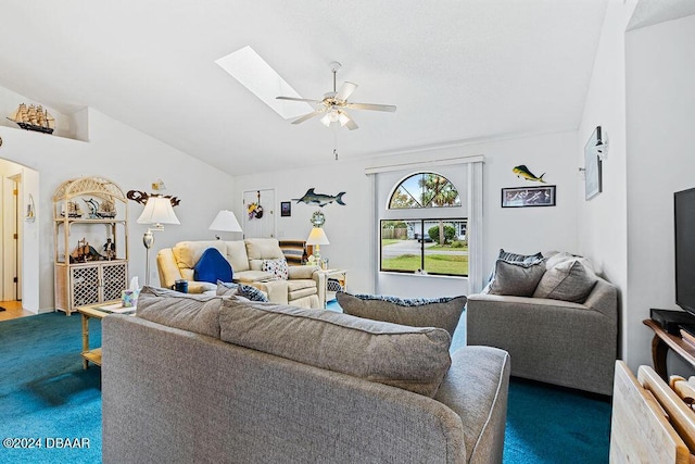 carpeted living room with lofted ceiling with skylight and ceiling fan