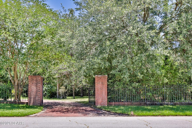 view of gate with fence