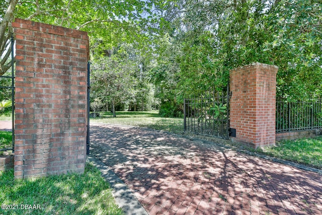 view of gate with fence