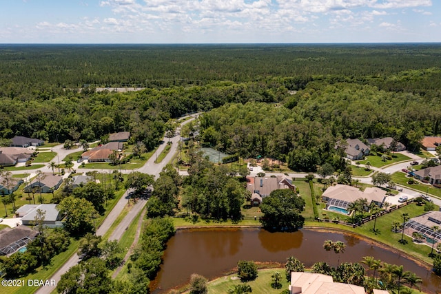 birds eye view of property featuring a residential view, a forest view, and a water view