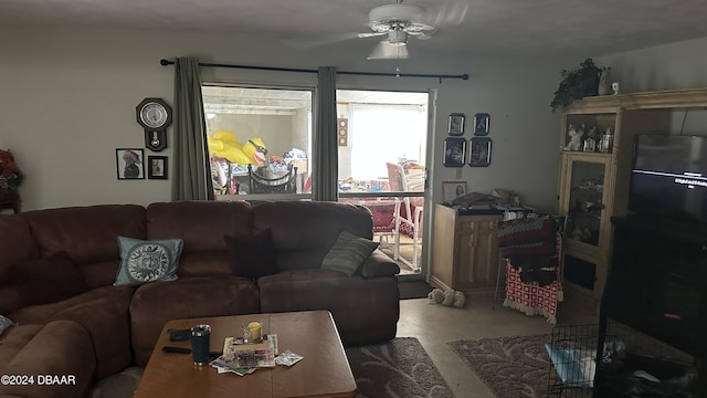 living room featuring carpet flooring and ceiling fan