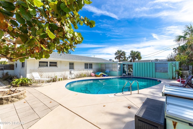 view of swimming pool featuring a patio