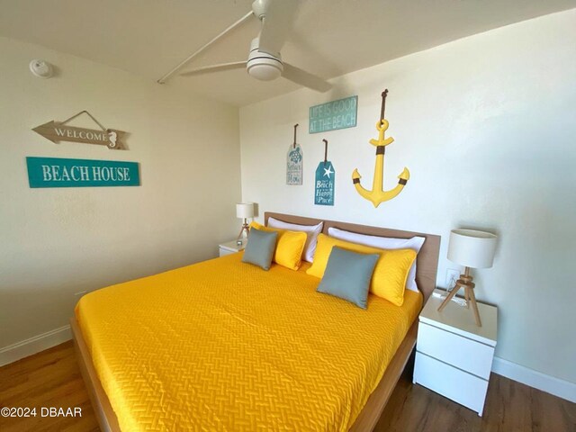 bedroom featuring dark hardwood / wood-style flooring and ceiling fan