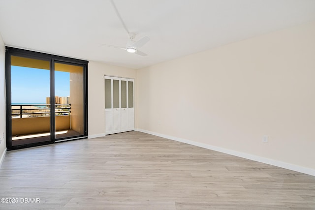 1 Oceans W Blvd Unit 7B5, Daytona Beach, FL 32118 - spare room with baseboards, ceiling fan, and wood finished floors
