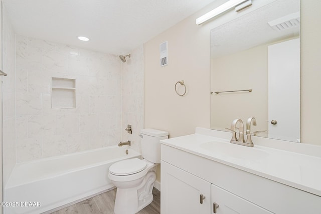 1 Oceans W Blvd Unit 7B5, Daytona Beach, FL 32118 - bathroom featuring vanity, toilet, bathing tub / shower combination, wood finished floors, and visible vents