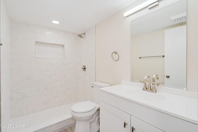 1 Oceans W Blvd Unit 7B5, Daytona Beach, FL 32118 - bathroom featuring vanity, toilet, tiled shower, and visible vents