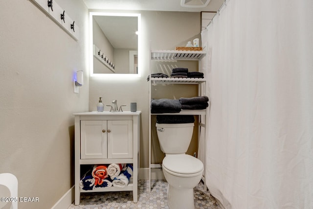 bathroom featuring vanity and toilet