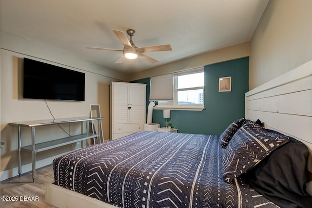 bedroom featuring hardwood / wood-style floors and ceiling fan