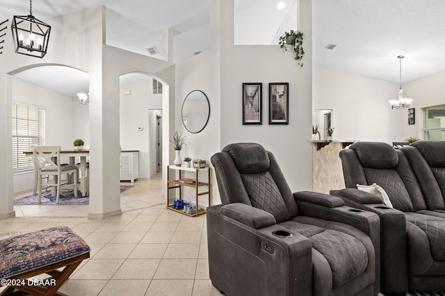 10 Pointing Pl, Palm Coast, FL 32164 - living area with a chandelier, arched walkways, light tile patterned floors, a towering ceiling, and baseboards