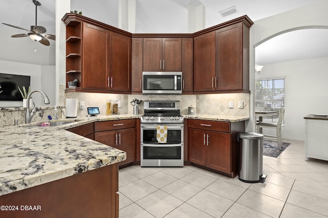 10 Pointing Pl, Palm Coast, FL 32164 - kitchen with appliances with stainless steel finishes, a sink, open shelves, ceiling fan, and backsplash