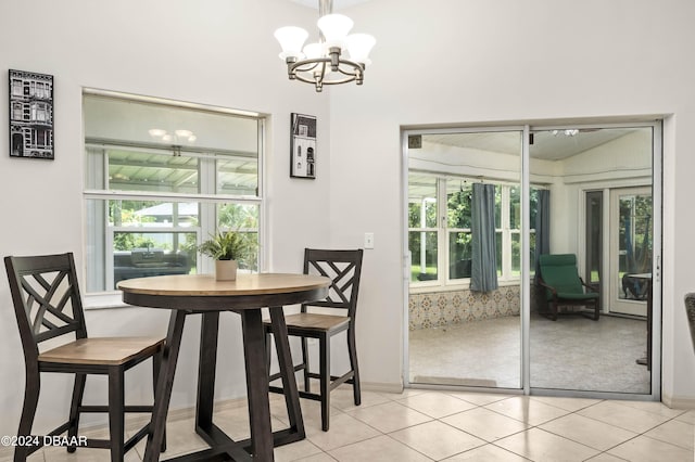 10 Pointing Pl, Palm Coast, FL 32164 - dining area featuring a chandelier, healthy amount of natural light, light tile patterned flooring, and baseboards