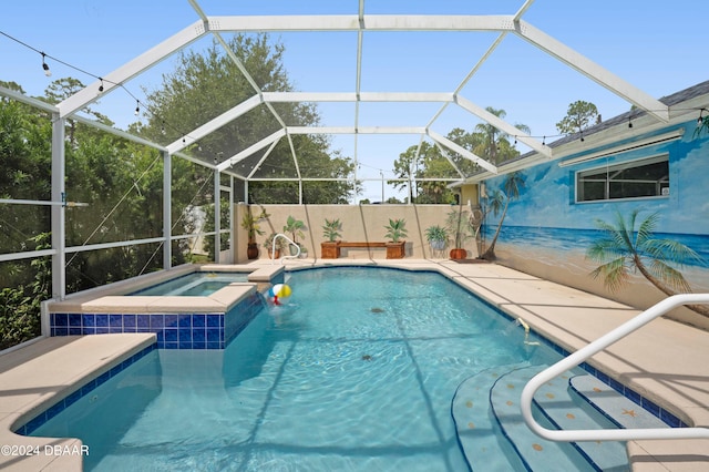 view of swimming pool with a lanai and an in ground hot tub