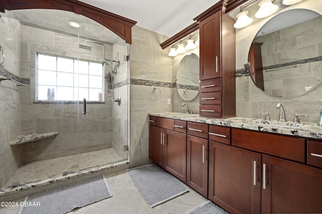 10 Pointing Pl, Palm Coast, FL 32164 - bathroom with a shower stall, double vanity, and tile walls