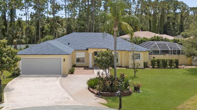 view of front of house with a garage and a front yard