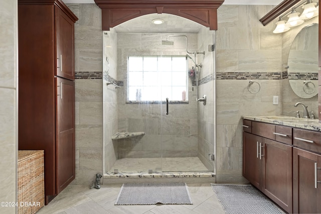 10 Pointing Pl, Palm Coast, FL 32164 - full bathroom with a stall shower, vanity, tile patterned floors, and tile walls