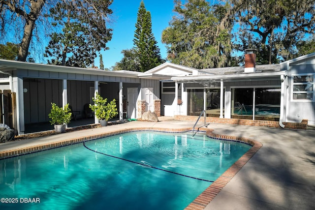 view of swimming pool featuring a patio