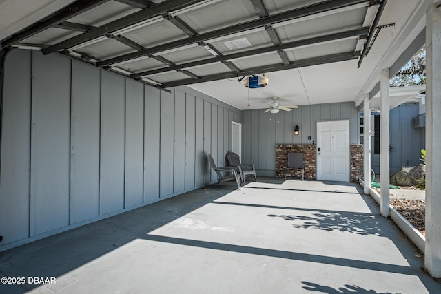 garage with ceiling fan and a garage door opener