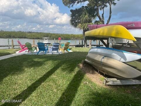 43 Jacaranda Cay Ct Unit 430, New Smyrna Beach, FL 32169 - exterior space with a patio area, a yard, and a water view