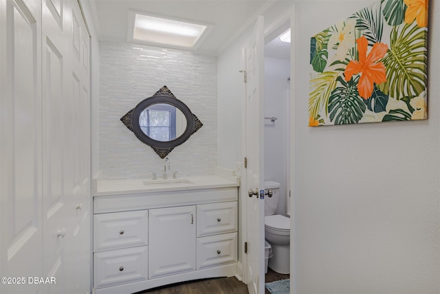 43 Jacaranda Cay Ct Unit 430, New Smyrna Beach, FL 32169 - bathroom with wood finished floors, vanity, and toilet