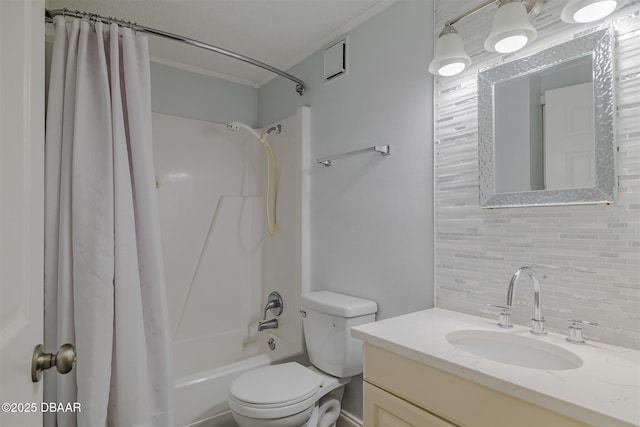 43 Jacaranda Cay Ct Unit 430, New Smyrna Beach, FL 32169 - full bathroom with vanity, backsplash, toilet, and shower / tub combo with curtain