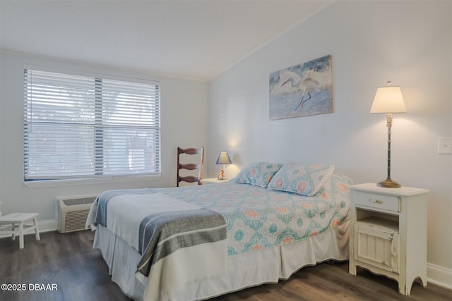 43 Jacaranda Cay Ct Unit 430, New Smyrna Beach, FL 32169 - bedroom featuring dark wood-style floors, vaulted ceiling, a wall mounted AC, and baseboards