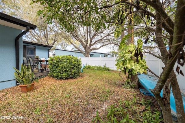 43 Jacaranda Cay Ct Unit 430, New Smyrna Beach, FL 32169 - view of yard with a fenced backyard and a deck