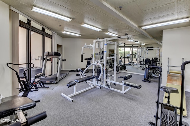 exercise room with a drop ceiling