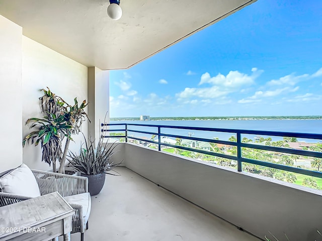 balcony featuring a water view