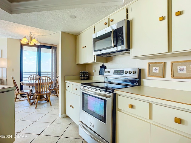 kitchen with light countertops, a chandelier, and stainless steel appliances