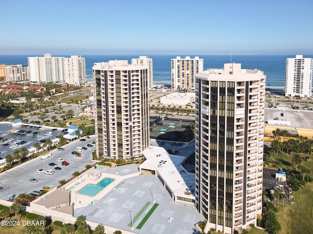 aerial view featuring a view of city and a water view