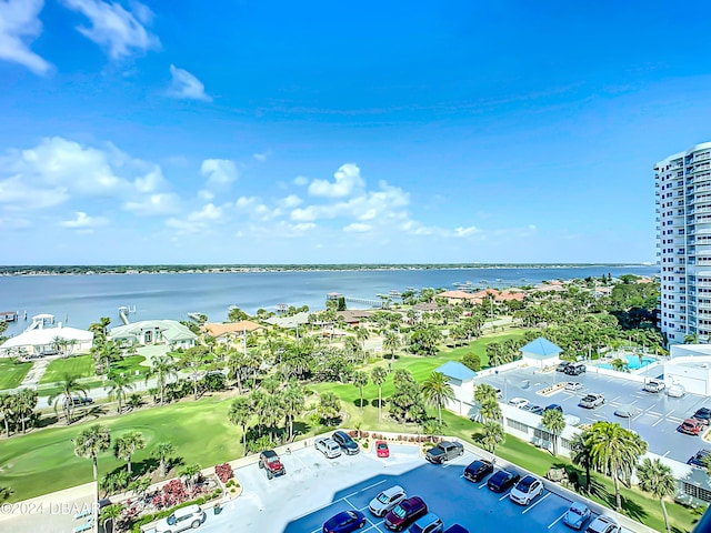 bird's eye view with a water view and view of golf course