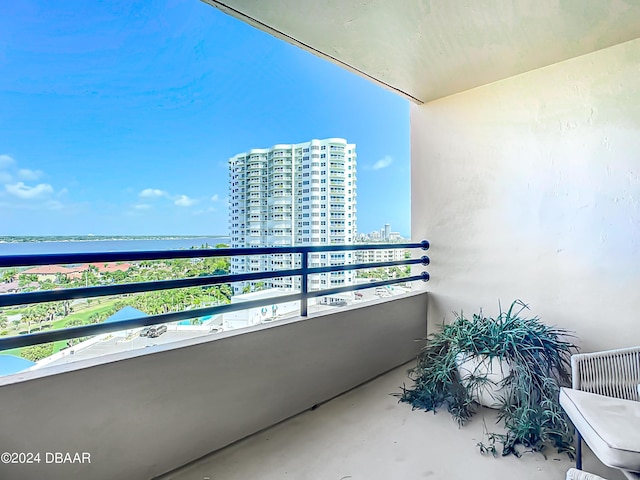 balcony with a view of city and a water view