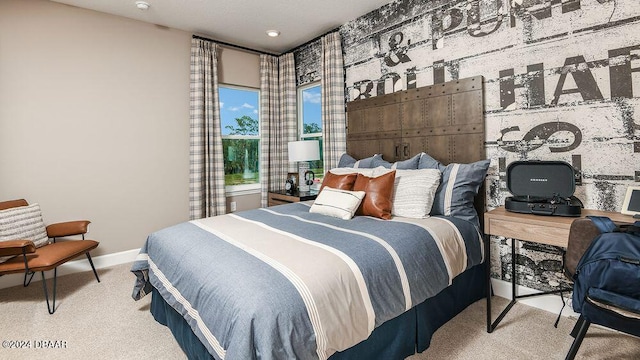 bedroom featuring light colored carpet