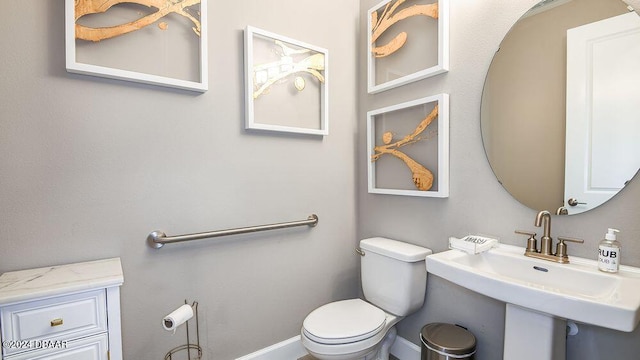 bathroom with sink and toilet