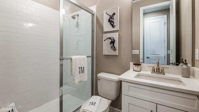 bathroom with vanity, toilet, and walk in shower