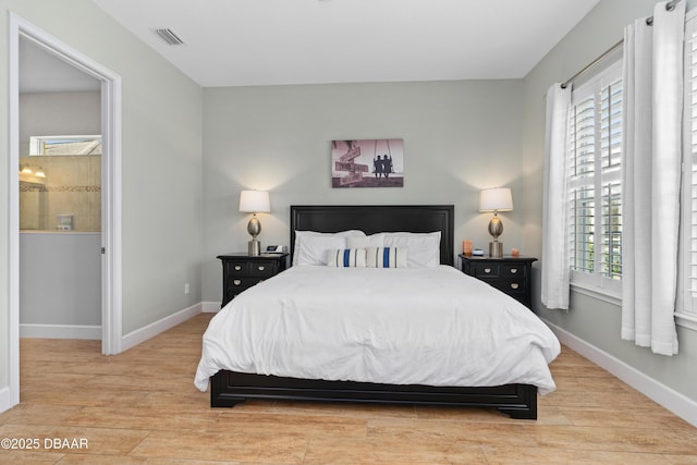 6871 Forkmead Ln, Port Orange, FL 32128 - bedroom with wood finished floors, multiple windows, and baseboards