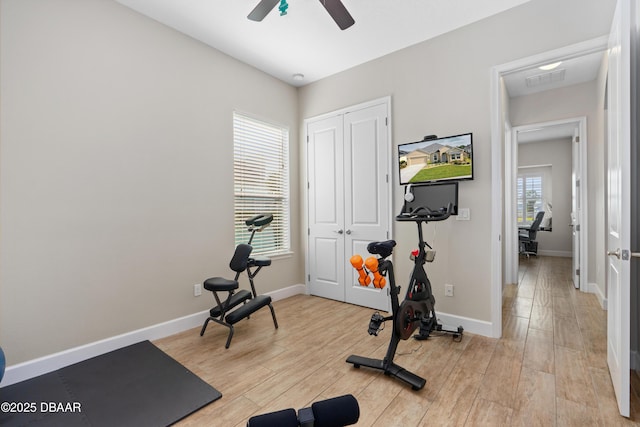 6871 Forkmead Ln, Port Orange, FL 32128 - workout area featuring ceiling fan, light wood finished floors, and baseboards