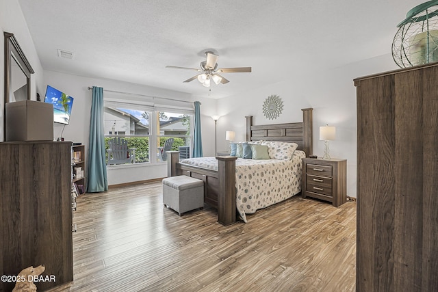 108 Shoal Creek Cir, Daytona Beach, FL 32114 - bedroom with a ceiling fan, visible vents, and wood finished floors