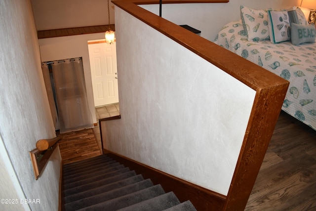 staircase with wood finished floors