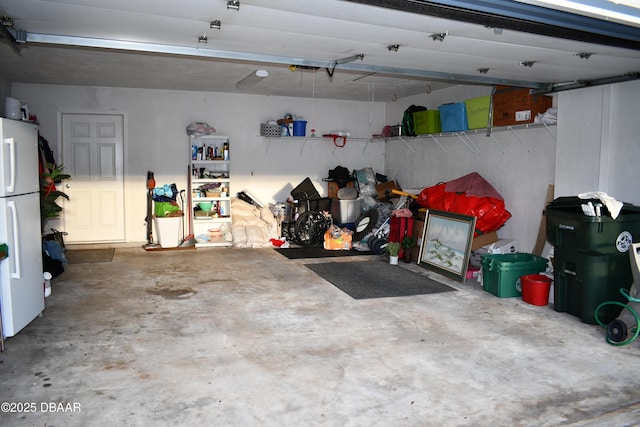 garage with freestanding refrigerator