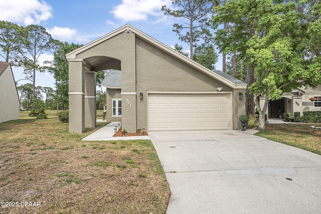 108 Shoal Creek Cir, Daytona Beach, FL 32114 - view of side of property with an attached garage, driveway, and stucco siding