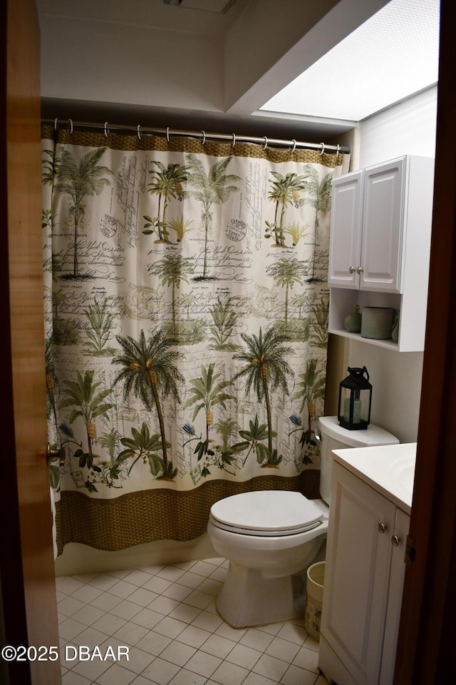 full bathroom with vanity, tile patterned floors, toilet, and a shower with curtain