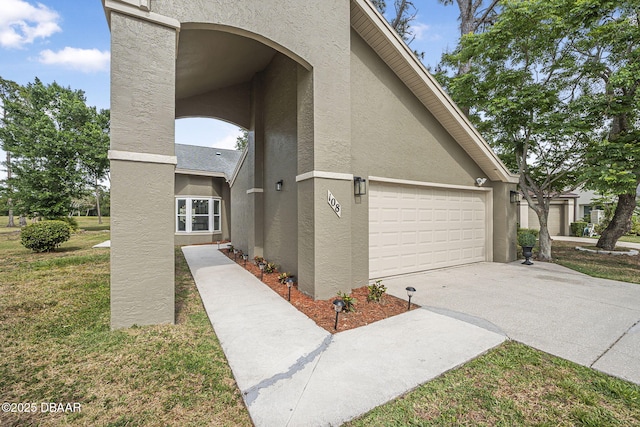 108 Shoal Creek Cir, Daytona Beach, FL 32114 - view of home's exterior with a garage, stucco siding, and concrete driveway