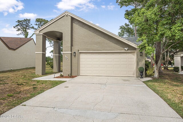 108 Shoal Creek Cir, Daytona Beach, FL 32114 - mid-century inspired home with a garage, stucco siding, driveway, and a front yard